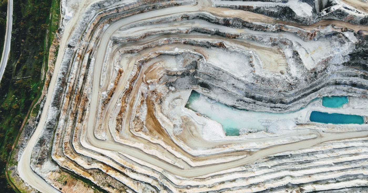 Top-down drone photograph of a terraced quarry