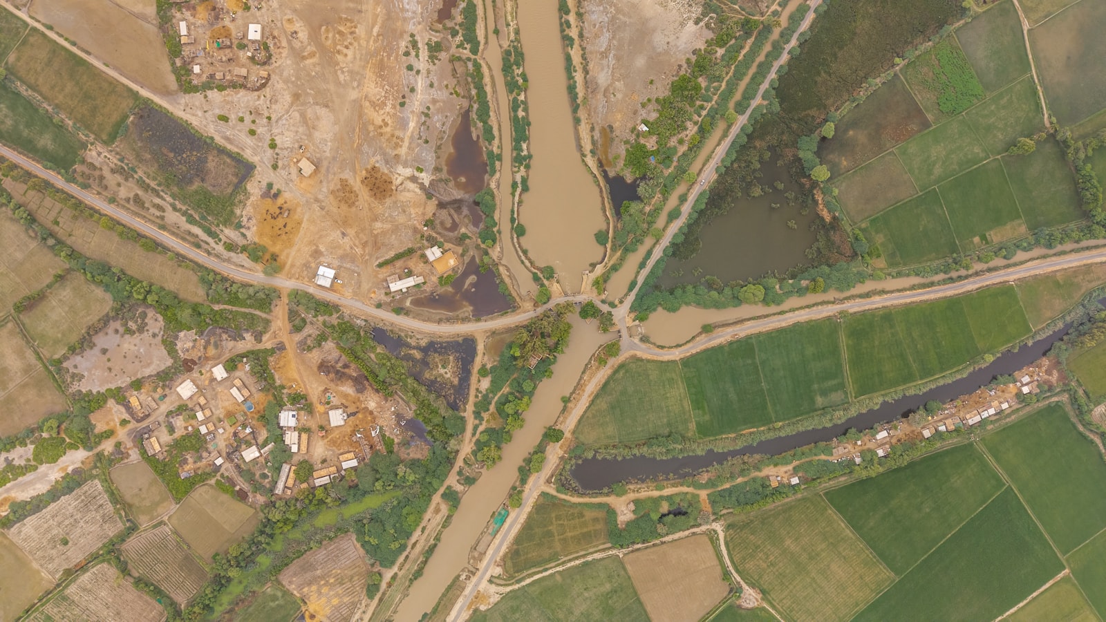 Top-down drone photograph of rural land, roads and waterways